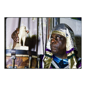 Sun Ra with a Horus sculpture inside his home in Germantown, PA, 1980 — photograph by Veryl Oakland